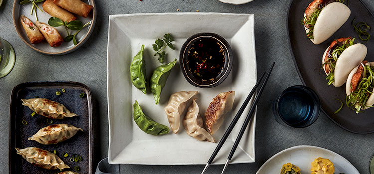 Q&A: Fusion dishes are a versatile way to put global flavors on the menu [Image: plate of dumplings with dipping sauce]