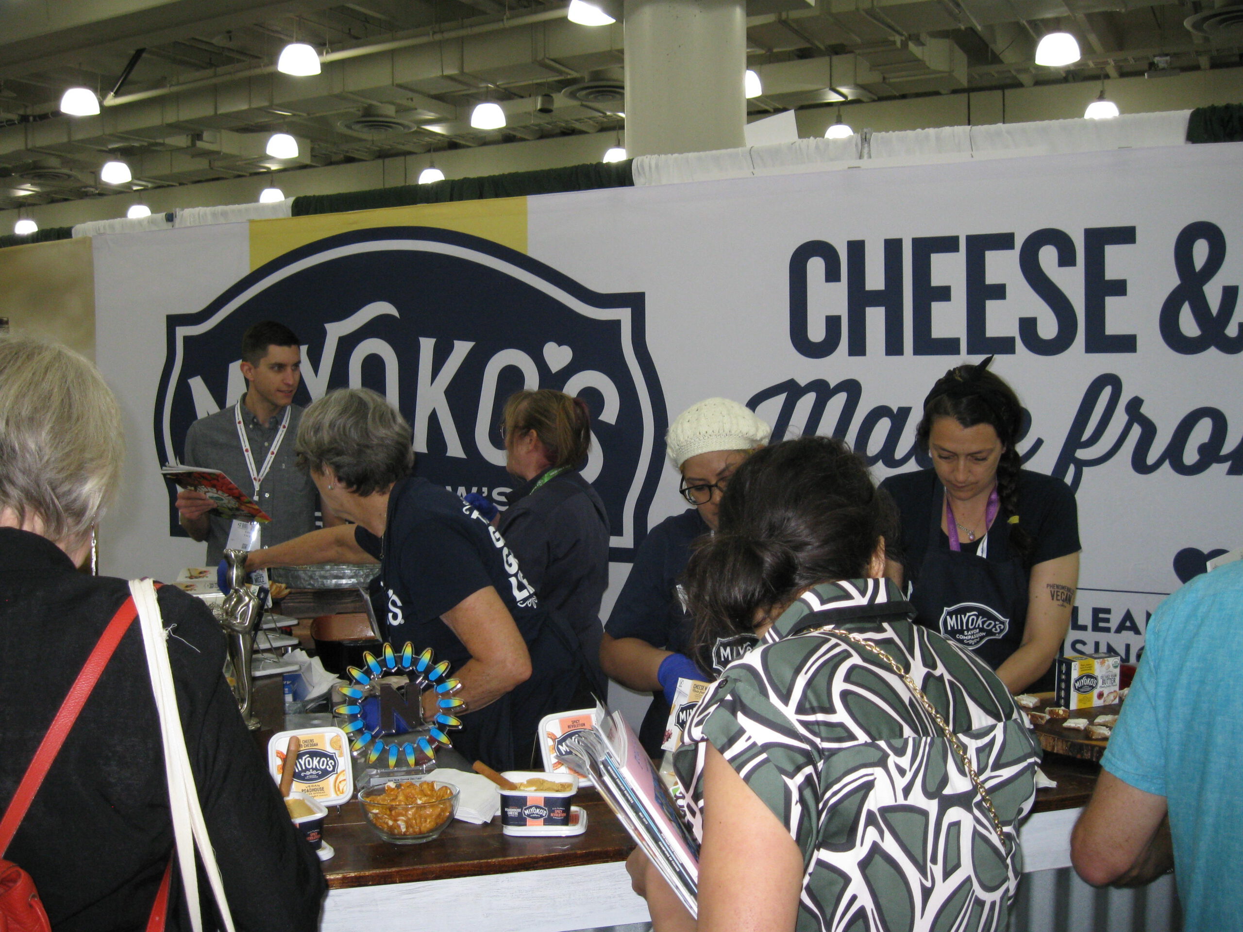 Attendees lined up to taste vegan cheese at the Miyoko's booth at the Plant Based World Conference and Expo.