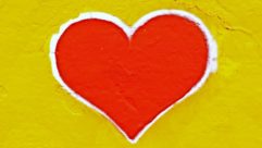 A red heart on a yellow background