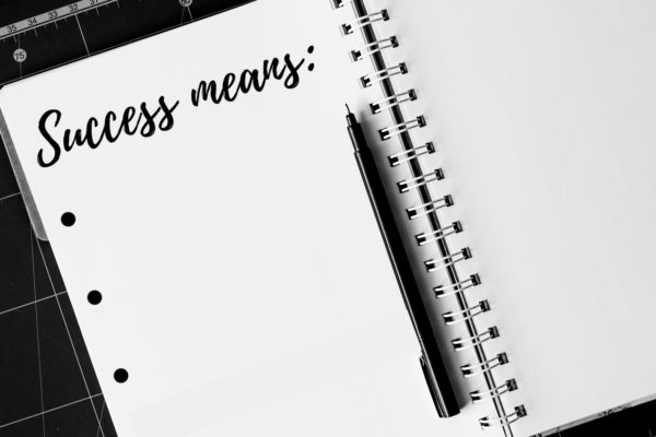 Notebook page that says "Success" on it