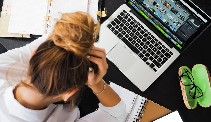 Image of stressed-out woman at work illustrating owning your value