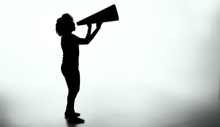 A person is shouting into a megaphone.