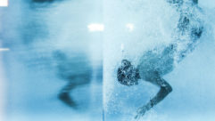 A swimmer in the water as a symbol on onboarding as immersion