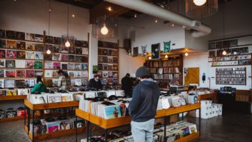 People shop at a record store.