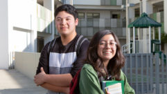 2 students in front of building competency-based education