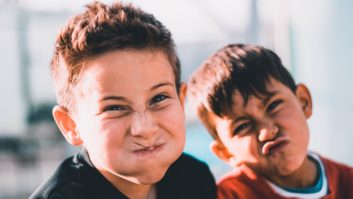 two boys making funny face Scaling student behavior and support through SEL