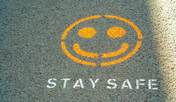 "Safe" and smiley face on pavement for safe schools