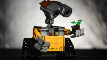 Wall-E robot holding tiny plant for robots and values article
