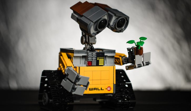 Wall-E robot holding tiny plant for robots and values article