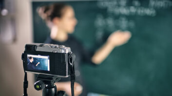 Young teacher teaching remotely using camera to stream lesson. for article on video for coaching