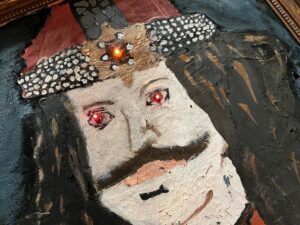 Student-painted Dracula portrait with light-up eyes in the student-build escape room at Thomas A. Edison Career & Technical Education High School in New York or article on project-based learning
