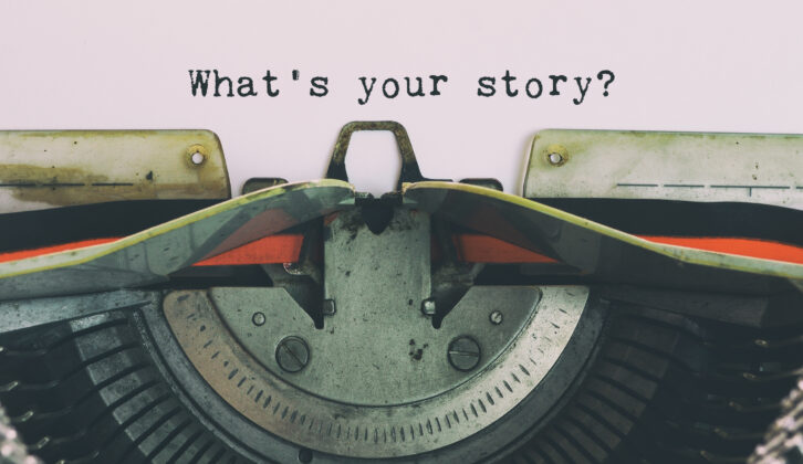 vintage typewriter with paper that reads "What's your story?"