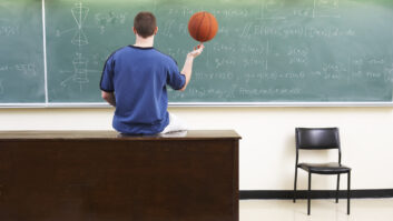 Person holding basketball with fingertips facing a blackboard with advanced math for story on math people