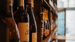 Paving the way for a more inclusive wine industry [Image: wine bottles on a shelf]